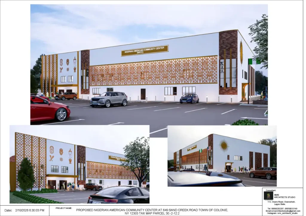 Architectural view of the building from the street corner showing the entrance and paneling.